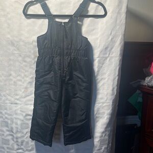 Little boy or a little girl black bib overall ski suit. Adjustable.